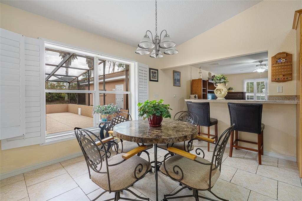 4190 Southwest 103rd Street Road Ocala, FL 34476 - Photo 38 of 55 a view of a dining room with furniture window and outside view