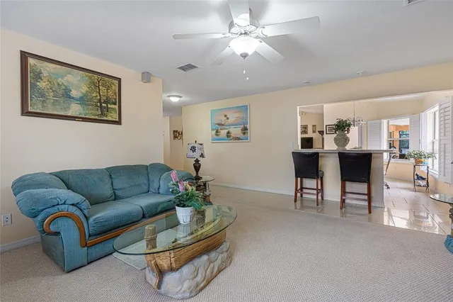 a bed room with a bed window and a chair