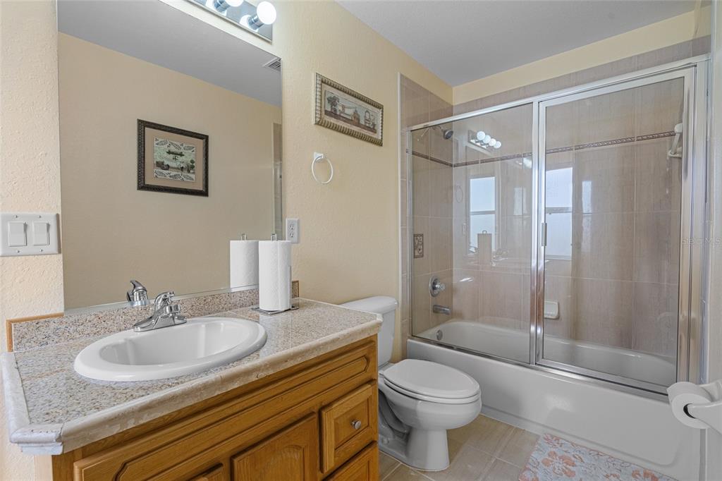 4190 Southwest 103rd Street Road Ocala, FL 34476 - Photo 46 of 55 a bathroom with a sink toilet and shower