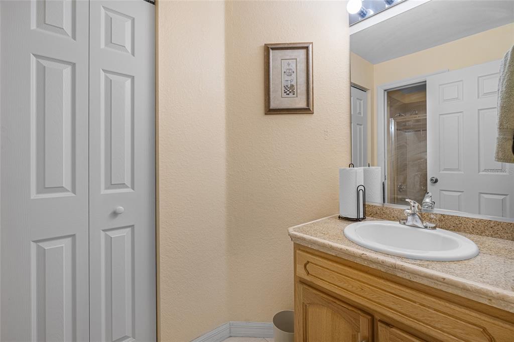 4190 Southwest 103rd Street Road Ocala, FL 34476 - Photo 49 of 55 a bathroom with a sink and a mirror