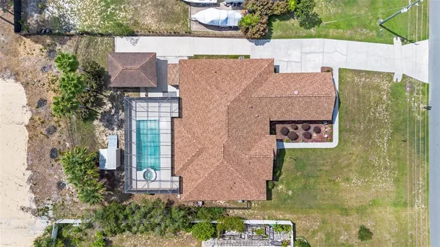 aerial view of a house with a yard