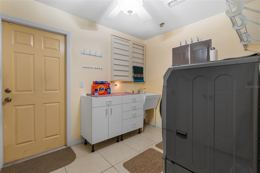 4190 Southwest 103rd Street Road Ocala, FL 34476 - Photo 51 of 55 a room with cabinets and wooden floor