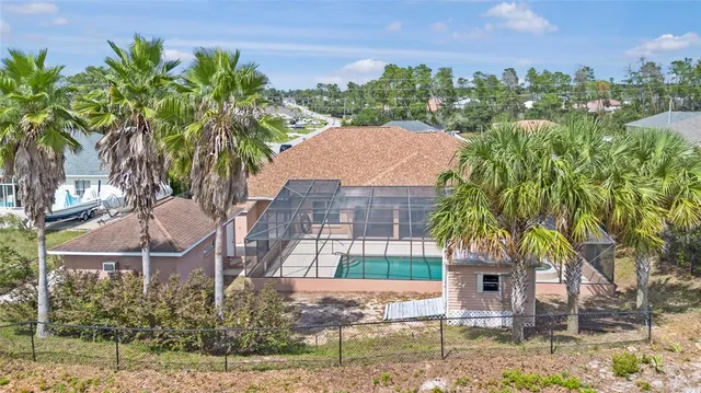 a aerial view of a house with garden and plants