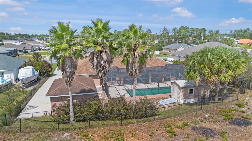4190 Southwest 103rd Street Road Ocala, FL 34476 - Photo 9 of 55 a backyard of a house with table and chairs