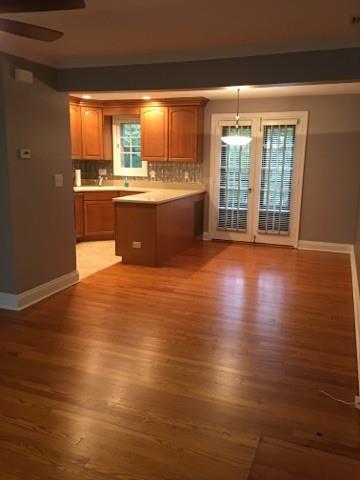 628 Olympia Road Pittsburgh, PA 15211 - Photo 3 of 15 a large kitchen with stainless steel appliances granite countertop a sink and cabinets with wooden floor