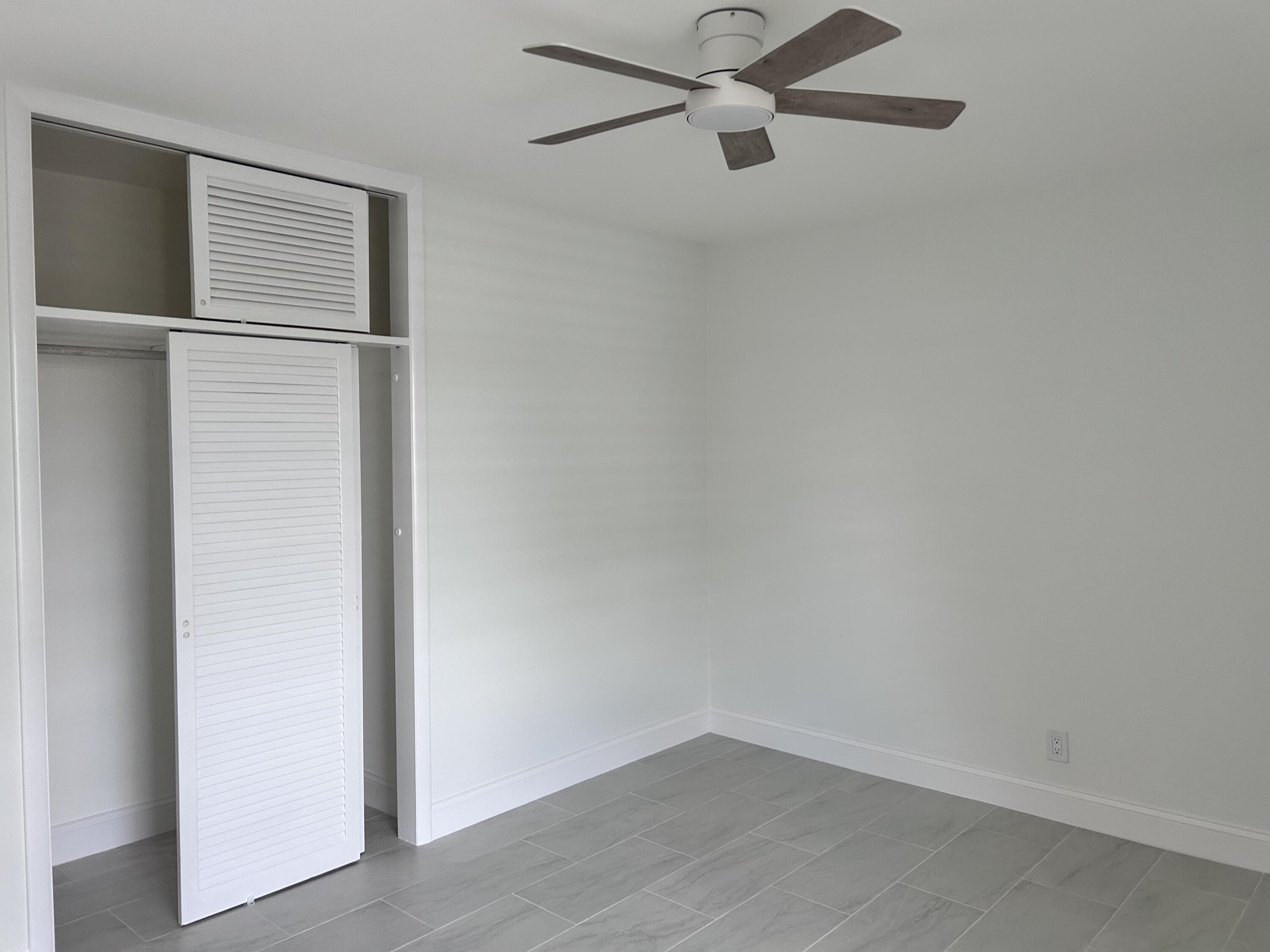 630 Prosperity Farms Road, Unit 2 North Palm Beach, FL 33408 - Photo 11 of 13 a view of a room with rack on the wall