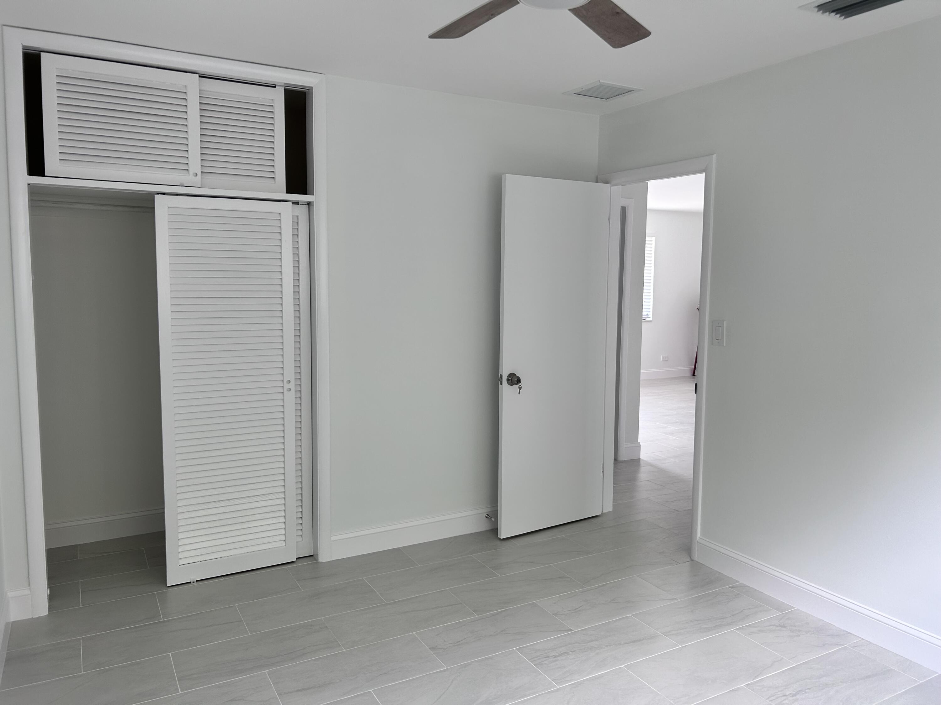 630 Prosperity Farms Road, Unit 2 North Palm Beach, FL 33408 - Photo 12 of 13 a view of empty room with closet