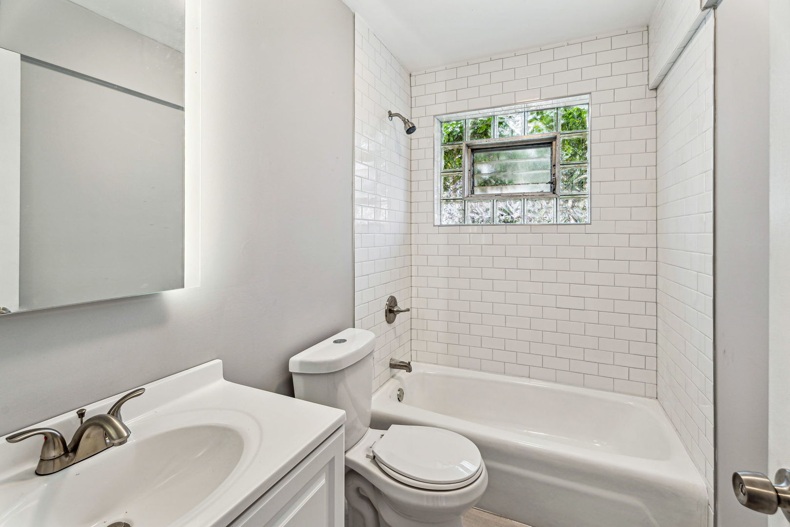 4247 North Keystone Avenue, Unit 1 Chicago, IL 60641 - Photo 13 of 18 a bathroom with a sink toilet and shower
