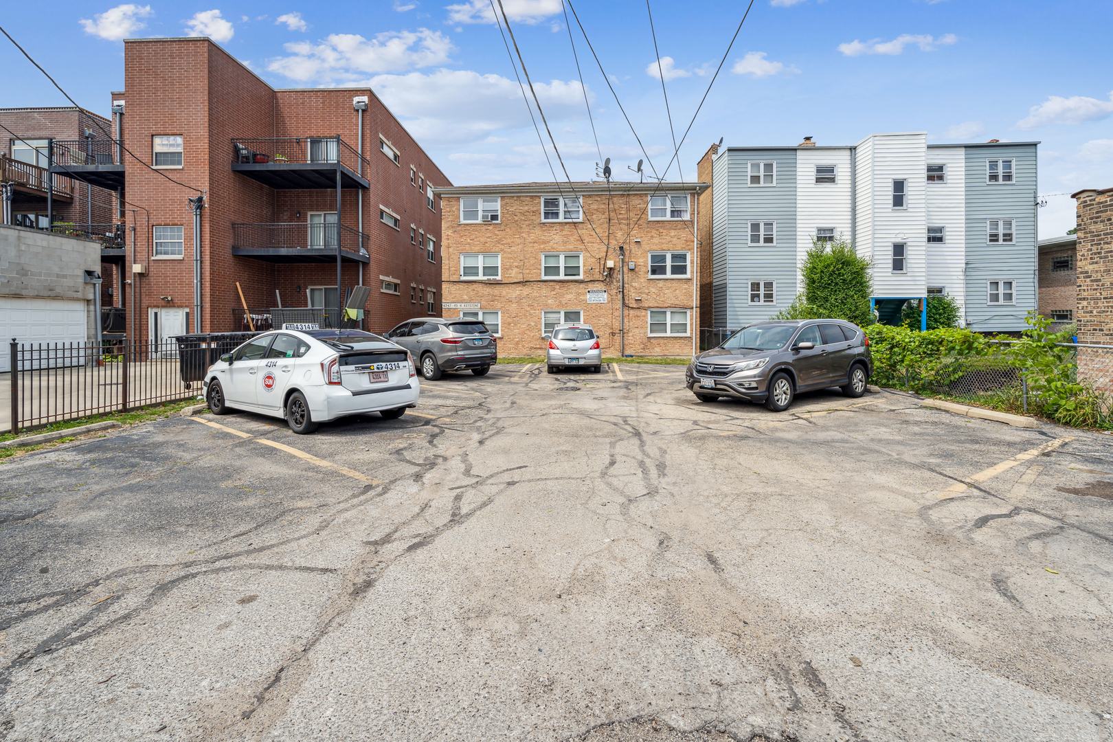 4247 North Keystone Avenue, Unit 1 Chicago, IL 60641 - Photo 16 of 18 a car parked in front of a building