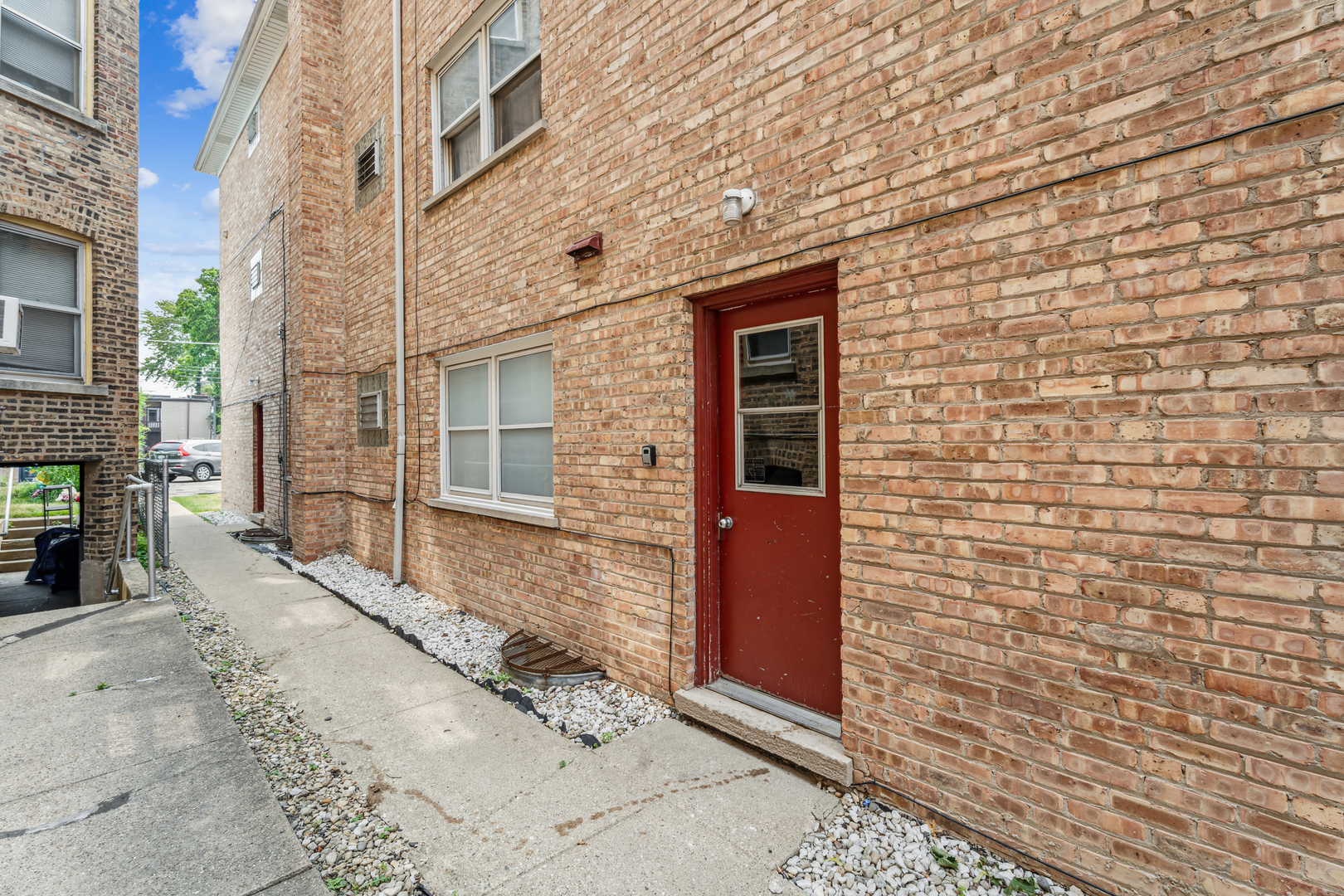 4247 North Keystone Avenue, Unit 1 Chicago, IL 60641 - Photo 18 of 18 a brick building with a window and a door
