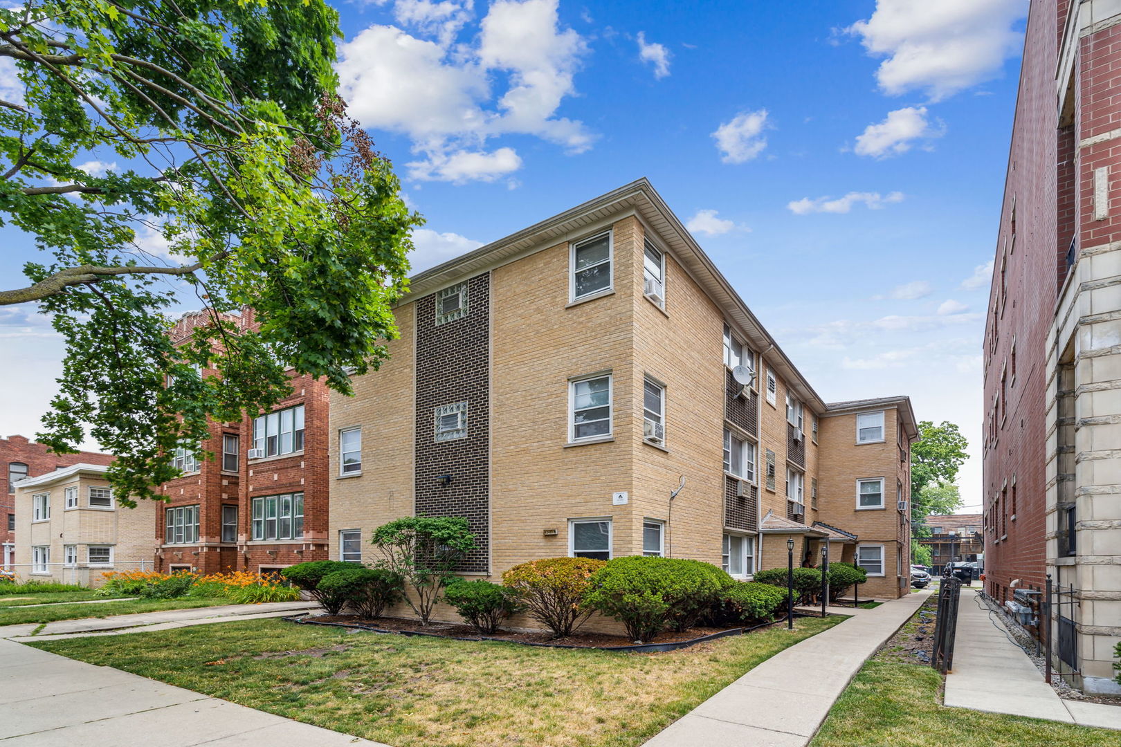 4247 North Keystone Avenue, Unit 1 Chicago, IL 60641 - Photo 2 of 18 a front view of a house with yard and green space
