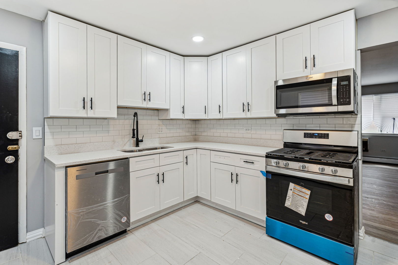4247 North Keystone Avenue, Unit 1 Chicago, IL 60641 - Photo 5 of 18 a kitchen with cabinets appliances and a sink