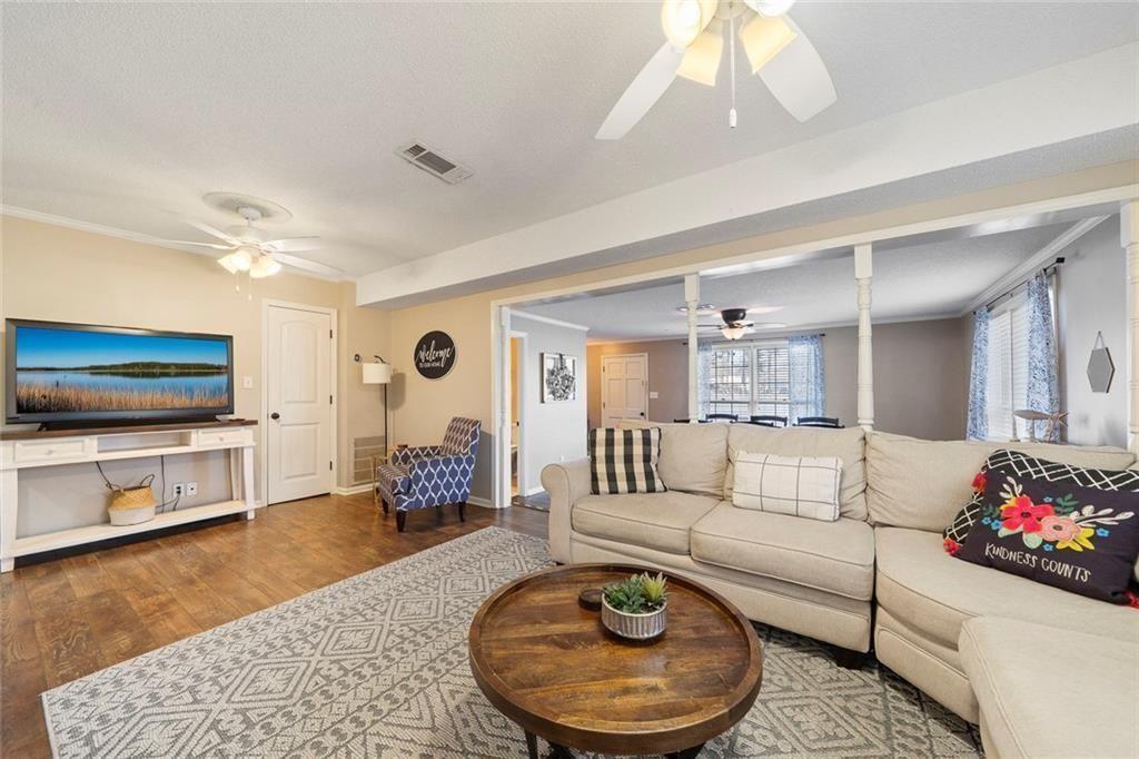 121 Little Riverview Road Eatonton, GA 31024 - Photo 22 of 53 a living room with furniture and a flat screen tv