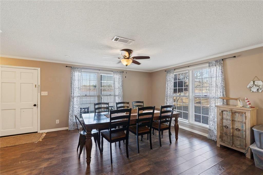121 Little Riverview Road Eatonton, GA 31024 - Photo 23 of 53 a view of a dining room with furniture and wooden floor