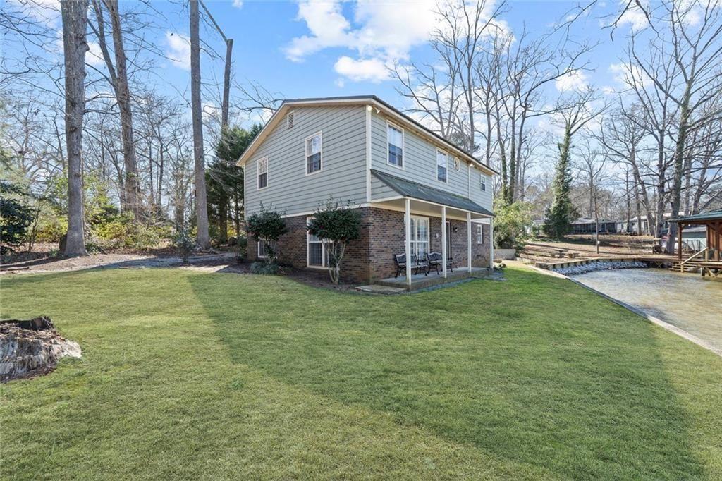 121 Little Riverview Road Eatonton, GA 31024 - Photo 7 of 53 a view of a house with a yard