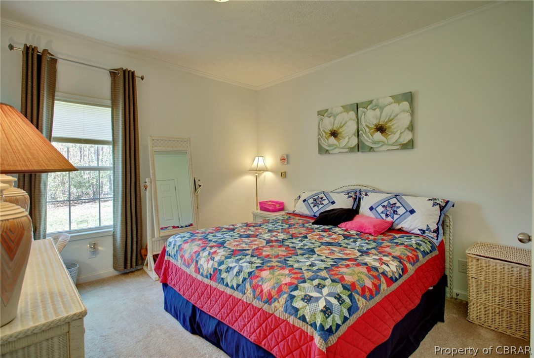 1496 Elsom Mascot Road Mattaponi, VA 23110 - Photo 23 of 33 a bedroom with a bed and glass window
