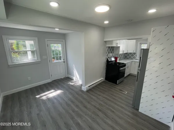 a view of livingroom with hardwood floor and a window