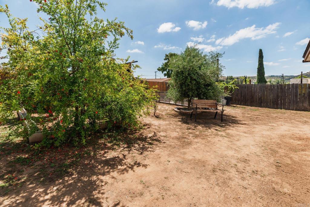 13425 Standish Drive Poway, CA 92064 - Photo 28 of 34 a view of a bench in a backyard