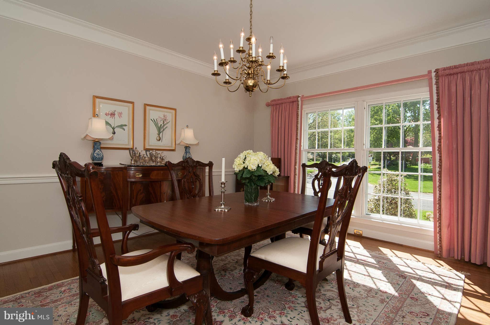 268 Providence Road Annapolis, MD 21409 - Photo 14 of 30 a view of a dining room with furniture a chandelier and wooden floor