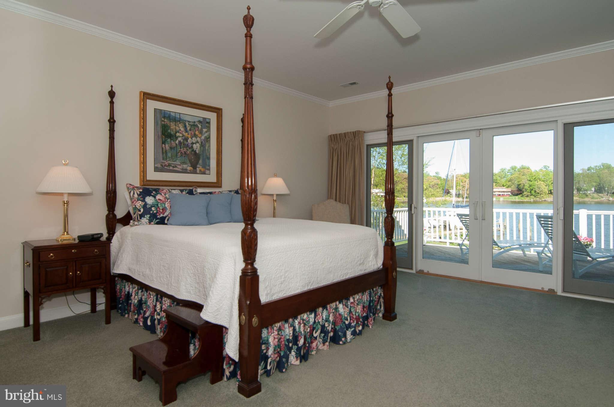 268 Providence Road Annapolis, MD 21409 - Photo 15 of 30 a bedroom with a bed window and a chandelier