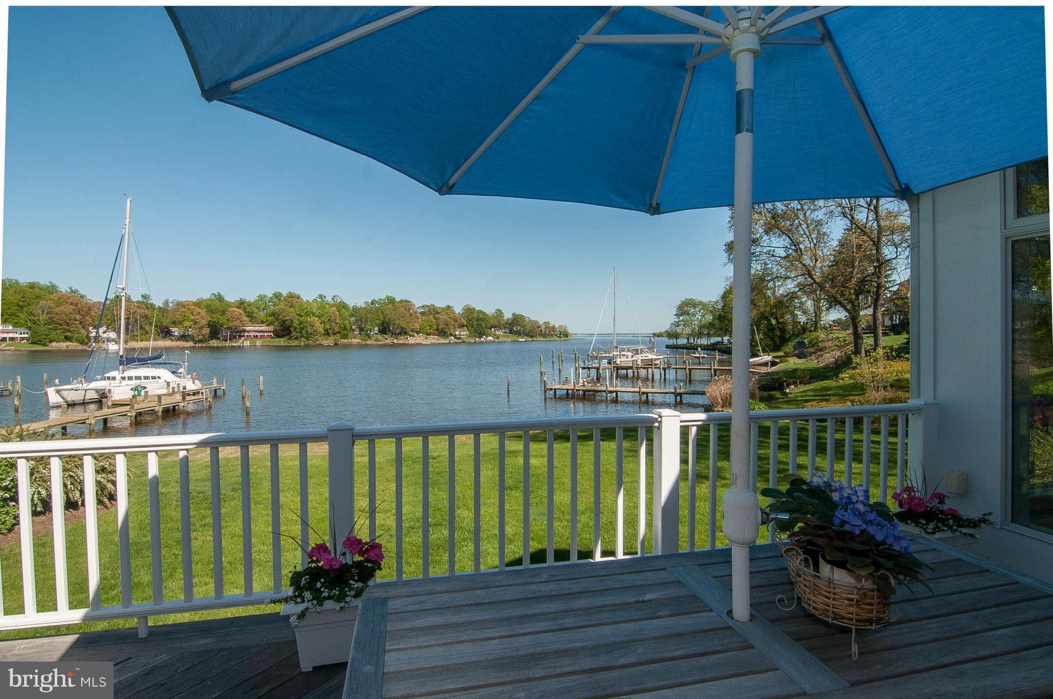 268 Providence Road Annapolis, MD 21409 - Photo 18 of 30 a view of a balcony with chairs and an umbrella