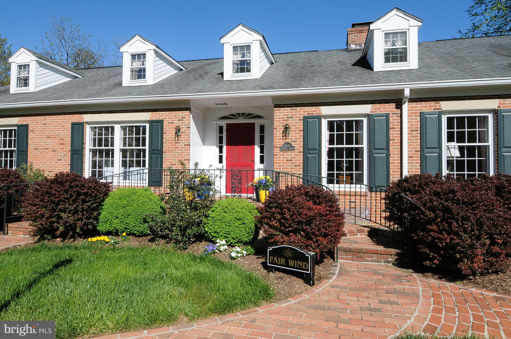 268 Providence Road Annapolis, MD 21409 - Photo 23 of 30 front view of a brick house with a yard