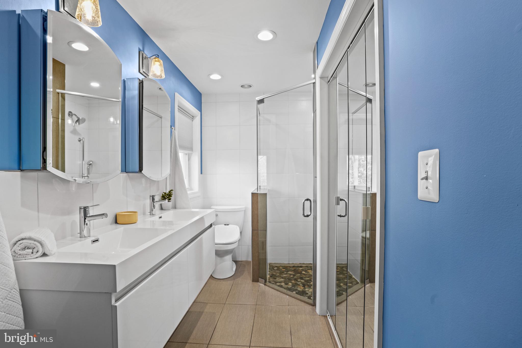 6708 Portree Court Springfield, VA 22152 - Photo 12 of 37 a bathroom with a sink mirror and shower