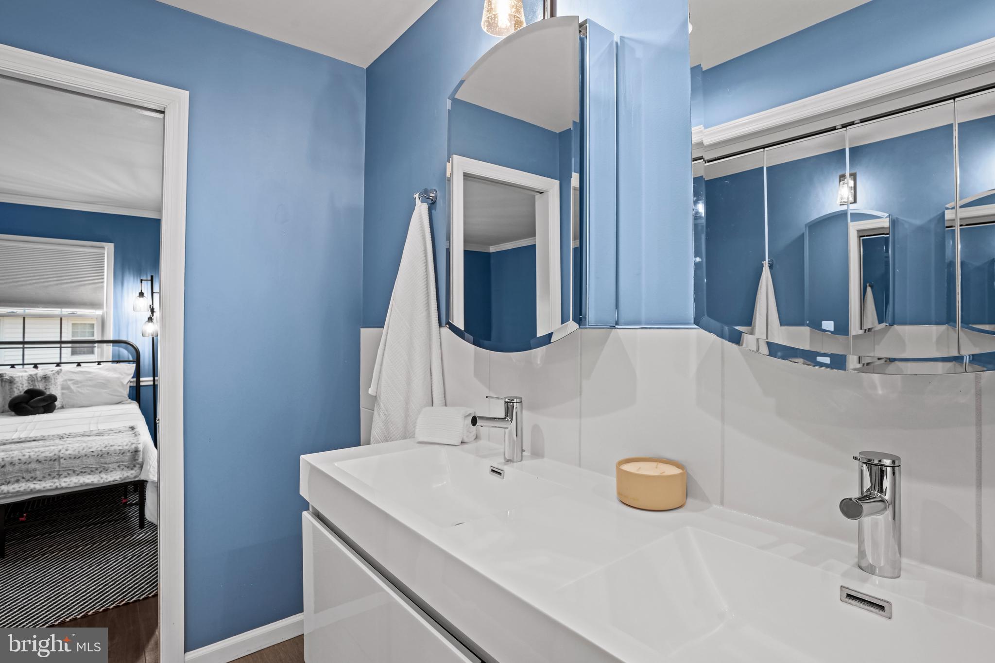 6708 Portree Court Springfield, VA 22152 - Photo 13 of 37 a en suite bathroom with a sink and a mirror