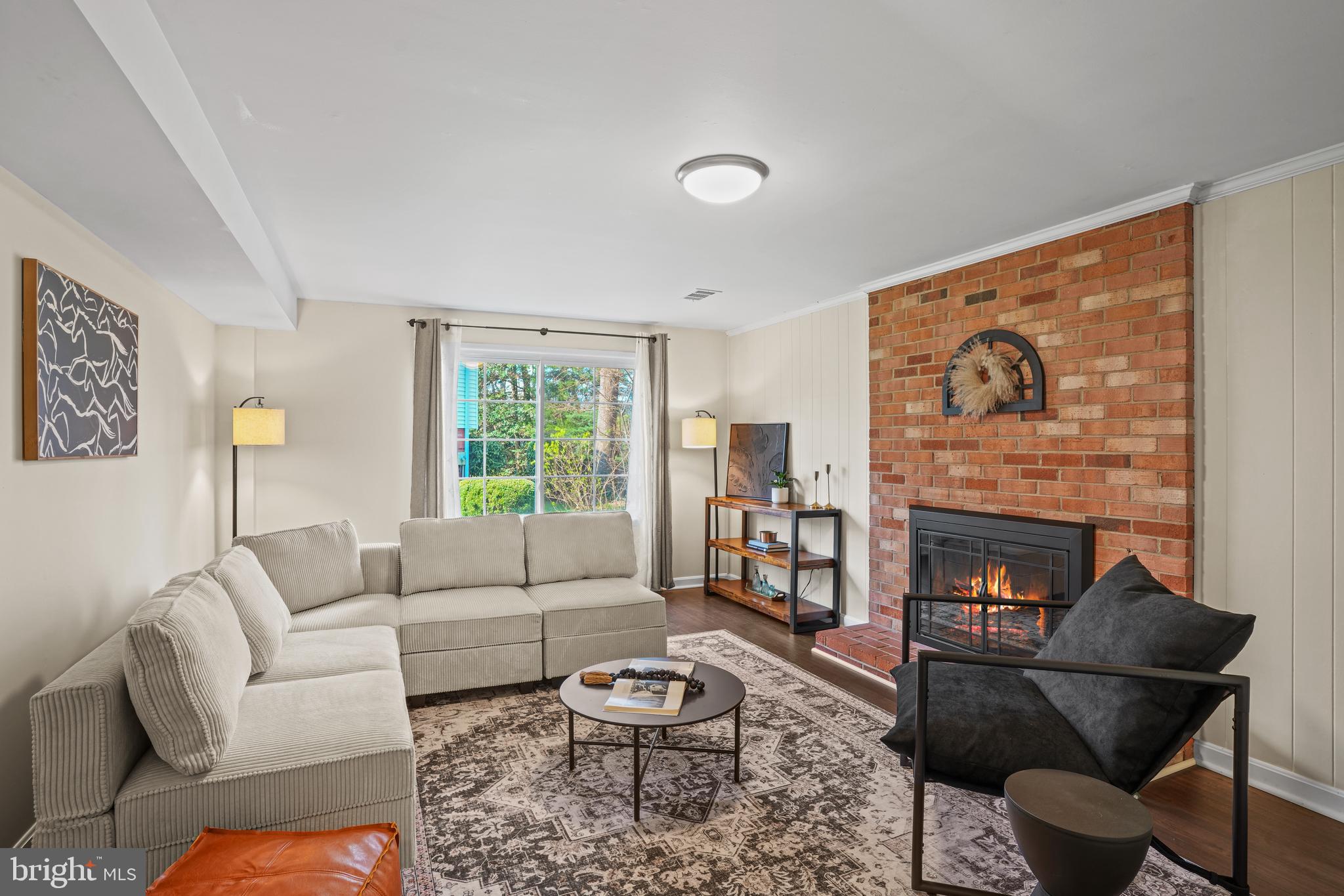6708 Portree Court Springfield, VA 22152 - Photo 15 of 37 a living room with furniture and a fireplace