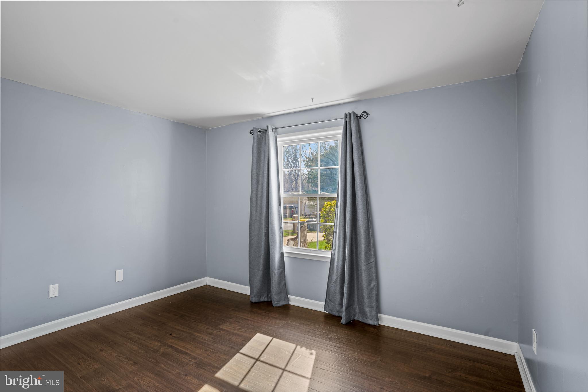 6708 Portree Court Springfield, VA 22152 - Photo 17 of 37 an empty room with wooden floor and windows
