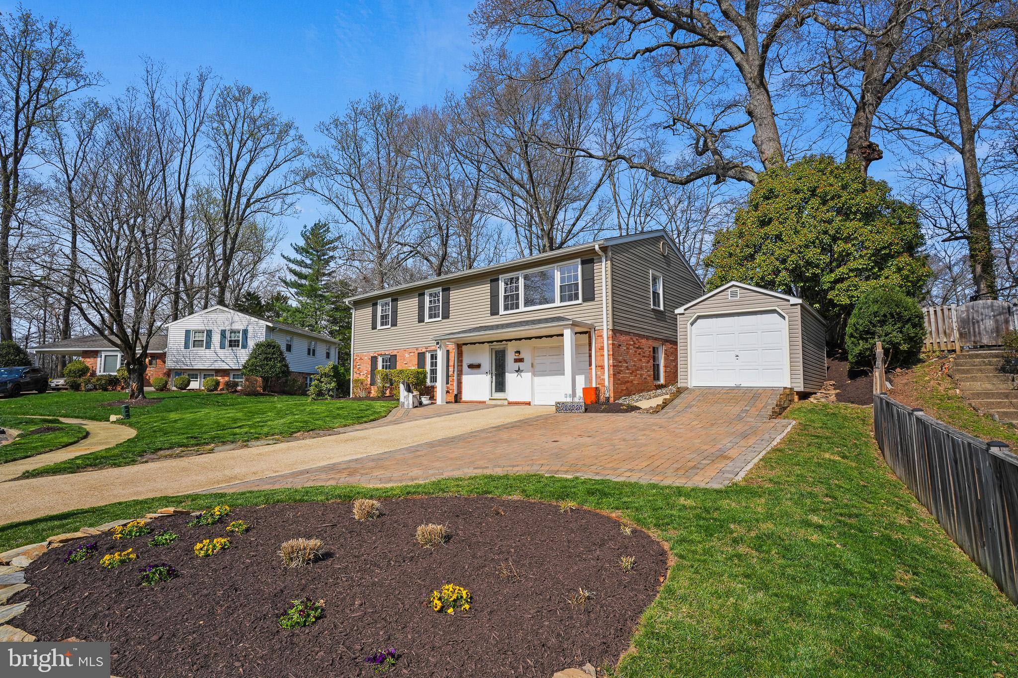 6708 Portree Court Springfield, VA 22152 - Photo 2 of 37 a front view of a house with garden