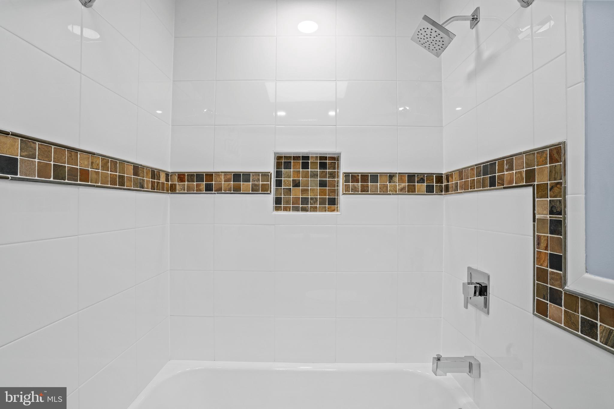 6708 Portree Court Springfield, VA 22152 - Photo 28 of 37 a bathroom with a bathtub and a shower