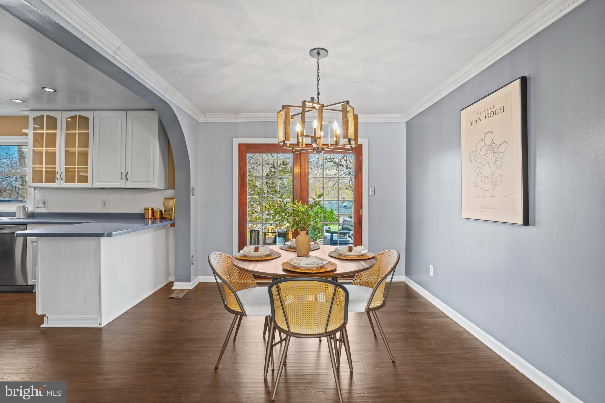 6708 Portree Court Springfield, VA 22152 - Photo 8 of 37 a dining room with furniture a chandelier and wooden floor