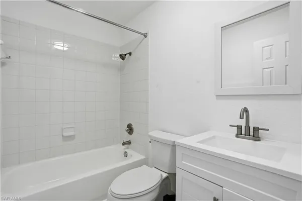 a bathroom with a sink a toilet and bathtub