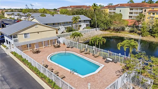 an aerial view of a house with a swimming pool