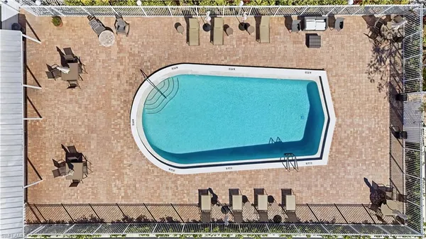a bathroom with a bathtub and mirror
