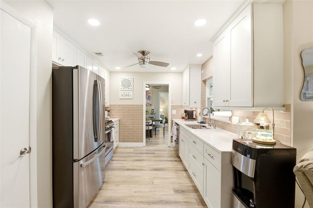 2636 Talbot Road Fern Park, FL 32730 - Photo 18 of 47 a large kitchen with a large counter top appliances and cabinets