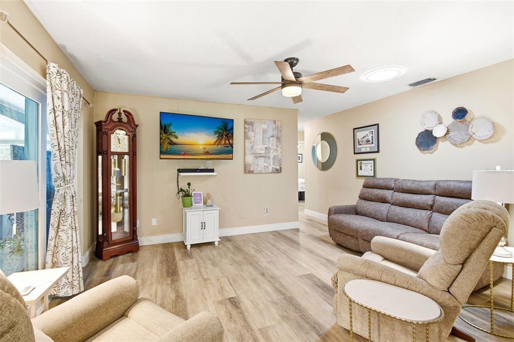 2636 Talbot Road Fern Park, FL 32730 - Photo 19 of 47 a living room with furniture and a flat screen tv