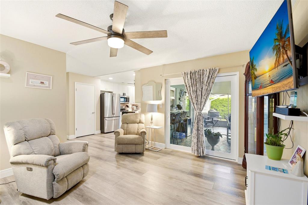 2636 Talbot Road Fern Park, FL 32730 - Photo 22 of 47 a living room with furniture and a chandelier