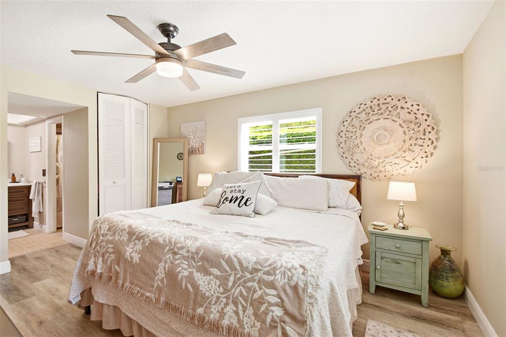 2636 Talbot Road Fern Park, FL 32730 - Photo 23 of 47 a bedroom with a large bed and a chandelier