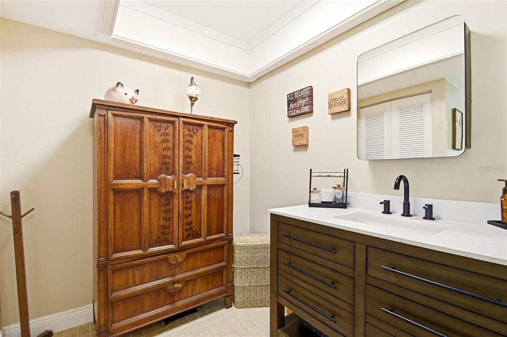 2636 Talbot Road Fern Park, FL 32730 - Photo 25 of 47 a bathroom with a shower sink and mirror