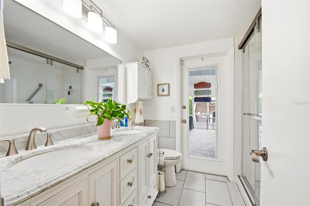 2636 Talbot Road Fern Park, FL 32730 - Photo 28 of 47 a bathroom with a granite countertop sink and a mirror