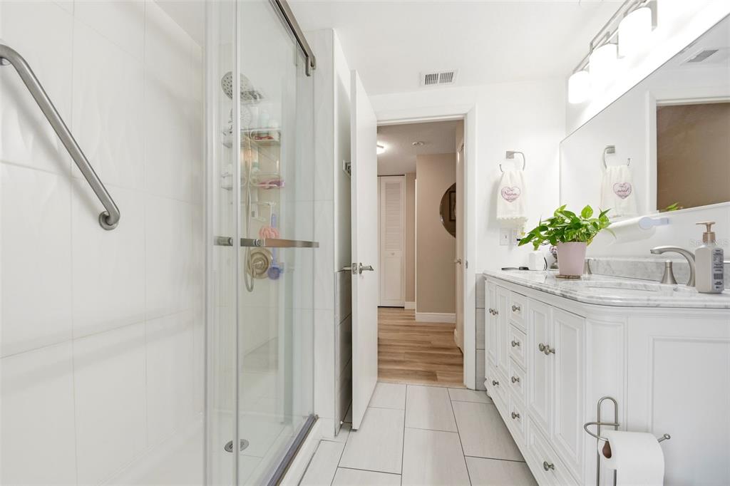 2636 Talbot Road Fern Park, FL 32730 - Photo 29 of 47 a bathroom with a granite countertop sink a mirror and shower