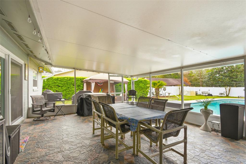 2636 Talbot Road Fern Park, FL 32730 - Photo 32 of 47 a view of an outdoor dining space with furniture and garden