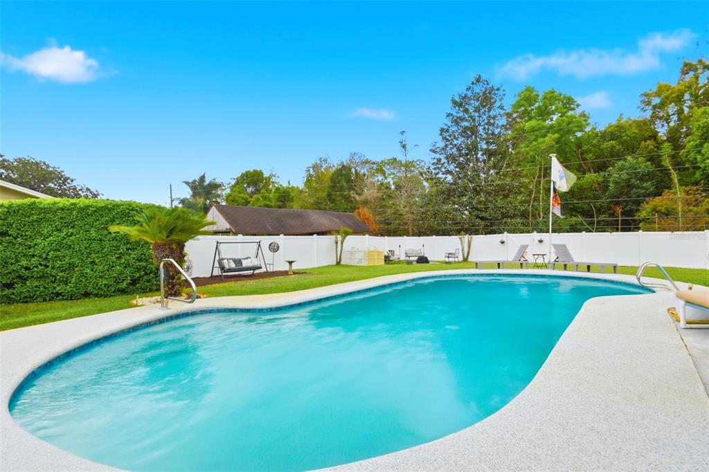 2636 Talbot Road Fern Park, FL 32730 - Photo 34 of 47 a view of a swimming pool with an outdoor seating and yard