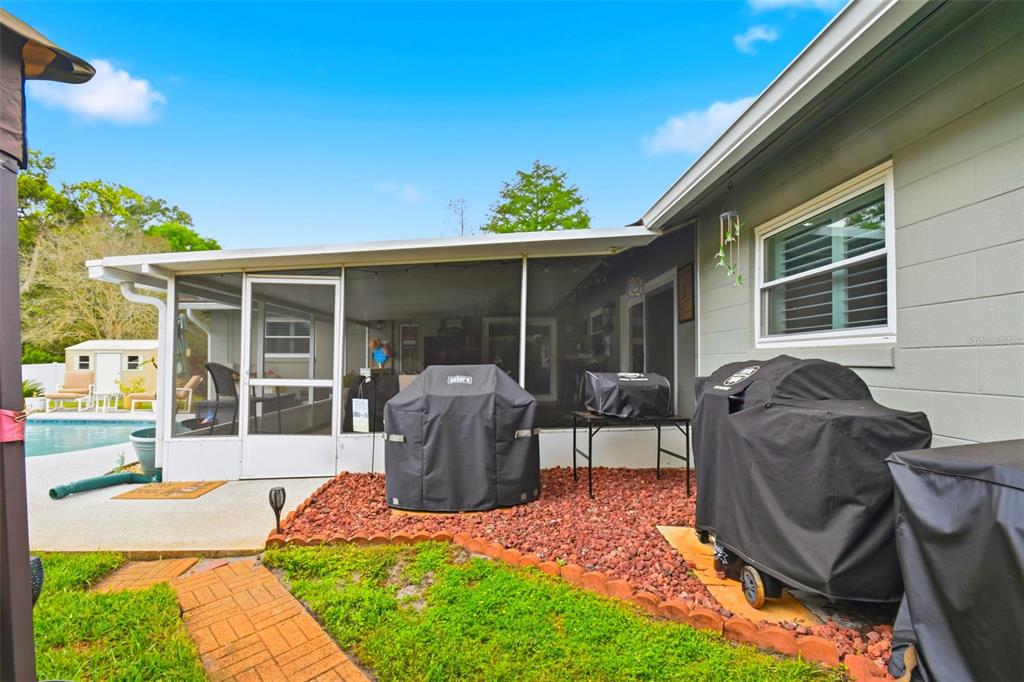 2636 Talbot Road Fern Park, FL 32730 - Photo 39 of 47 a view of a house with backyard sitting area and garden