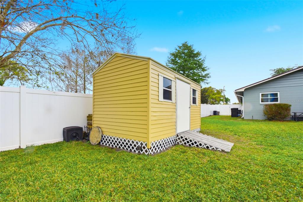 2636 Talbot Road Fern Park, FL 32730 - Photo 40 of 47 a view of a backyard with plants and a garden
