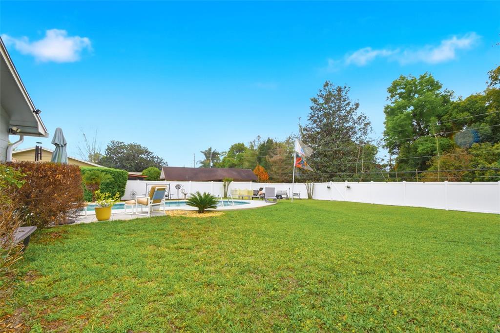 2636 Talbot Road Fern Park, FL 32730 - Photo 43 of 47 a view of pool with lawn chairs and large trees