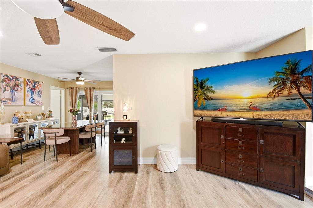 2636 Talbot Road Fern Park, FL 32730 - Photo 7 of 47 a living room with wooden floor furniture and a ceiling fan