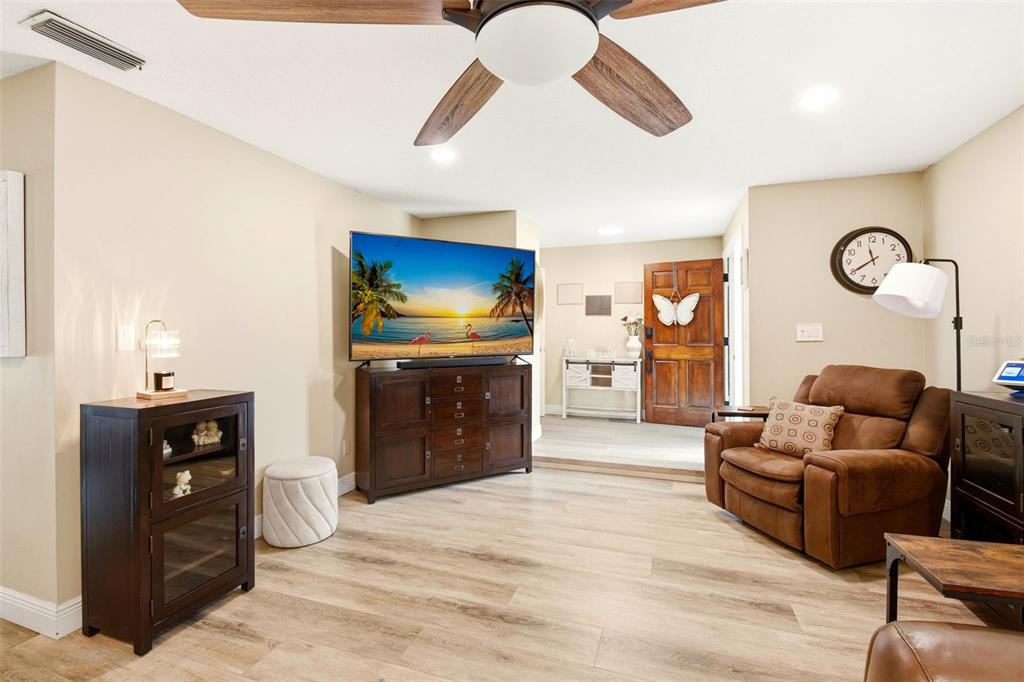 2636 Talbot Road Fern Park, FL 32730 - Photo 8 of 47 a living room with furniture and a flat screen tv
